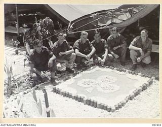 WEWAK POINT, NEW GUINEA. 1945-10-02. A SMARTNESS OF LINES COMPETITION WAS HELD AT 2/3 MACHINE GUN BATTALION AND TROOPS WERE GIVEN A WEEK TO DECORATE THEIR LINES. THE COMPETITION WAS WON BY A 10 ..