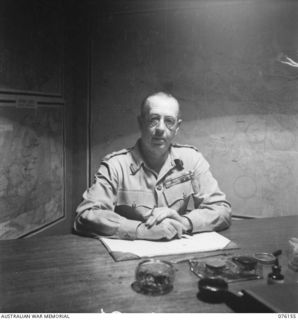 LAE, NEW GUINEA. 1944-09-18. VX13 LIEUTENANT GENERAL S.G. SAVIGE, CB, CBE, DSO, MC, ED, GOC NEW GUINEA FORCE AT WORK IN HIS OFFICE