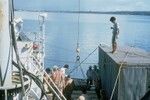 Loading explosives into [Taiwanese research vessel] Chiu Lien, Guam. Dr. Lu on van