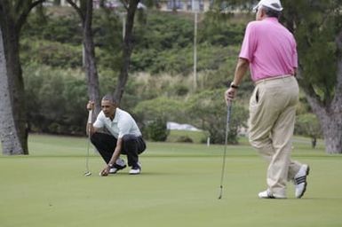 Barack Obama plays golf with Prime Minister Najib Razak, Joe Paulsen, and Mike Brush in Kaneohe Bay, Hawaii, December 24, 2014