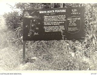 FINSCHHAFEN AREA, NEW GUINEA, 1944-03-17. ONE OF MANY BATTLE SIGNS IN THE AREA, THIS SIGN RECORDS ACTIVITIES OF THE 2/48TH INFANTRY BATTALION, AND THE 2/2ND MACHINE GUN BATTALION IN THE BATTLE FOR ..