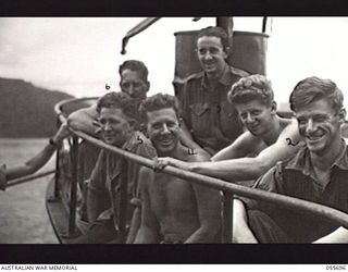 MOROBE, NEW GUINEA. 1943-08-15. MEMBERS OF THE 1ST AUSTRALIAN WATER TRANSPORT GROUP (SMALL CRAFT), ROYAL AUSTRALIAN ENGINEERS, ON BOARD THE AS25. FROM THE RIGHT: VX37080 WARRANT OFFICER (WO) 1 H. ..