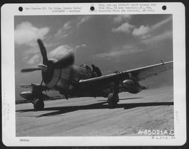 Pilot Of Republic P-47 'Thunderbolt', 318Th Fighter Group, Being Greeted By Air Force Man, After Completion Of Flight From Saipan, Marianas Islands, To Ie Shima, Ryukyu Retto. (U.S. Air Force Number A65021AC)