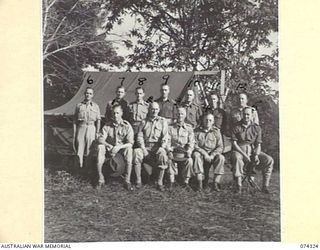 BULOLO, NEW GUINEA. 1944-07. MEMBERS OF THE EMPIRE PARLIAMENTARY DELEGATON WITH NX366 MAJOR GENERAL A.J. BOASE, CBE, GENERAL OFFICER COMMANDING, 11TH DIVISION (3) ON THE LAWN OUTSIDE THE GENERAL'S ..