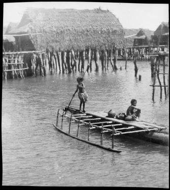 Two children in an outrigger canoe, one poling, Hanuabada, Papua, ca. 1923, 3 / Sarah Chinnery