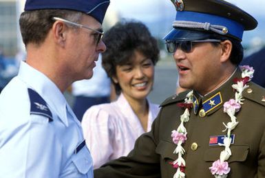 General (GEN) Yu of the People's Republic of China speaks with a US Air Force officer while attending a welcoming ceremony for the Chinese People's Liberation Army Air Force Song and Dance Troupe. The troupe is here on the final stop of its US tour