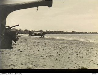 DUGUMUR BAY, NEW GUINEA. 1944-06-14. STINSON L-5 SENTINEL AIRCRAFT 42-98713 OF THE USAAF PREPARING TO TAKE OFF FROM A BEACH STRIP. THESE PLANES ARE BEING USED TO TRANSPORT MEMBERS OF 1ST PUNJAB ..