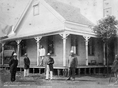 Rev Jabez B Watkin, Fotofili, J Afu, Rev Shirley Waldemar Baker, Prince Wellington and Junia standing outside a house in Neiafu, Tonga