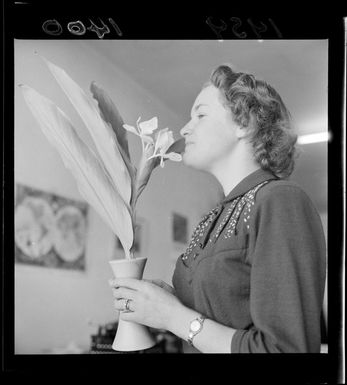 Mrs J Aboud with an Hawaiian white ginger flower stem in a vase