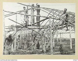 NADZAB AIRSTRIP, MARKHAM VALLEY, NEW GUINEA. 1944-10-24. PERSONNEL OF THE 18TH FIELD AMBULANCE BUILDING WARDS OF THE AIR EVACUATION HOSPITAL, OF THE MEDICAL AIR EVACUATION SERVICE, NEW GUINEA AND ..