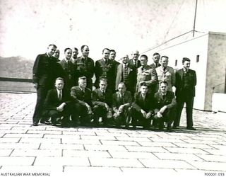 THE SOLOMON ISLANDS, 1945-02-17. GROUP PHOTOGRAPH OF THE AUSTRALIAN CIVIL AVIATION COMMISSION. (RNZAF OFFICIAL PHOTOGRAPH.)