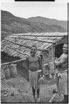 Pig festival, singsing preparations, Tsembaga: men with kundu drum and bamboo mouth harp