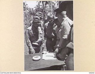 MUSCHU ISLAND, NEW GUINEA. 1945-09-24. MAJOR GENERAL H.C.H. ROBERTSON, GENERAL OFFICER COMMANDING 6 DIVISION AT THE HEADQUARTERS OF LIEUTENANT GENERAL K. YOSHIWARA, CHIEF OF GENERAL STAFF, 18 ..