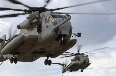 US Marine Corps (USMC) CH-53 Sea Stallion helicopters, Marine Medium Helicopter Squadron-263 (HMM-263) come in for a landing at Polaris Point Guam Naval Station to pick up US Army (USA) troops for transport to Tinian Island as part of Exercise TANDEM THRUST 2003