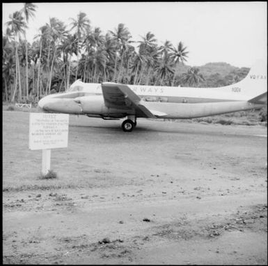 Fiji Airways plane on landing strip, Savusavu, Fiji, 1966 / Michael Terry