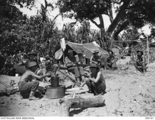 DAGUA, NEW GUINEA. 1945-03-27. HEADQUARTER SIGNALS, 2/2 INFANTRY BATTALION PERSONNEL PREPARING TEA AND CLEANING RIFLES AND OWEN GUNS AT BATTALION HEADQUARTERS. IDENTIFIED PERSONNEL ARE:- PRIVATE ..