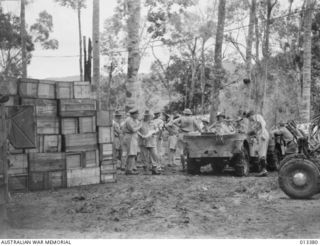 1942-10-08. GENERAL BLAMEY DISCUSSES THE PROGRAM WITH MAJOR-GENERAL ALLEN BEFORE THE OFFICIAL PARTY BEGINS ITS TOUR OF INSPECTIONS. IT IS AT THIS POINT THAT MECHANICAL TRANSPORT HAS TO GIVE WAY TO ..