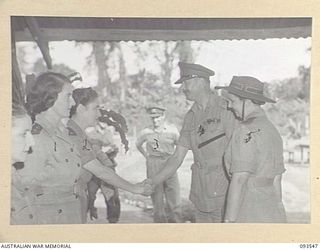 TOROKINA, BOUGAINVILLE. 1945-07-03. HIS ROYAL HIGHNESS, THE DUKE OF GLOUCESTER, GOVERNOR-GENERAL OF AUSTRALIA (4), BEING INTRODUCED TO MEMBERS OF THE AUSTRALIAN ARMY NURSING SERVICE BY MATRON M.E. ..