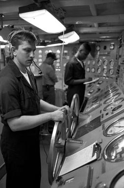 Engineering personnel aboard the amphibious assault ship USS SAIPAN (LHA 2) monitor the status of the ship's No. 1 boiler. The SAIPAN is on station off the coast of Liberia for Operation Sharp Edge