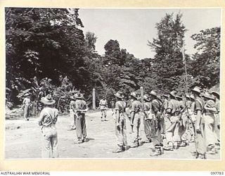 NAMANULA, NEW BRITAIN, 1945-10-08. MAJ-GEN K.W. EATHER, GCC 11 DIVISION, ADDRESSING A PARADE OF 11 DIVISION SIGNALS, AFTER HIS INSPECTION. IN HIS ADDRESS HE EXPLAINED THE SITUATION IN THE RABAUL ..