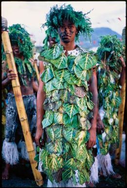 Young man bedecked in green leaves, Samoa
