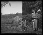 Man carrying water pails and woman with two children, Hawaii, 1938