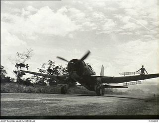 NADZAB, NEW GUINEA. C. 1944-02. A VULTEE VENGEANCE DIVE BOMBER AIRCRAFT OF NO. 21 SQUADRON RAAF TAXIING TO ITS DISPERSAL BAY AFTER A DIVE BOMBING RAID ON JAPANESE POSITIONS, WITH RIGGERS SITTING ON ..