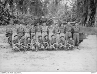 Group portrait of the personnel of the Administrative Troop, A Squadron, 2/4 Armoured Regiment. Left to right, back row: SX30356 Trooper (Tpr) R M King of Adelaide, SA; VX125224 Tpr S T Gosbell of ..