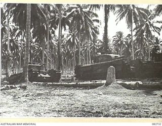 MADANG, NEW GUINEA. 1944-10-12. A CHURCHILL V FOLLOWED BY A CHURCHILL IV TANK RETURNING TO THE TANK PARK DURING TESTS CONDUCTED AT HQ 4 ARMOURED BRIGADE