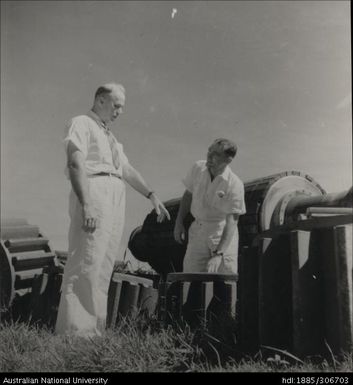 Officers inspecting machinery gears