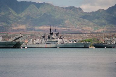 Two Leahy class decommissioned guided missile cruisers are moored in the Naval Ships Intermediate Maintenance Facility. The inboard ship is the USS WORDEN (CG 18). The WORDEN will be sunk on the 17th of June in a live fire missile shoot by units involved in Operation RIMPAC 2000