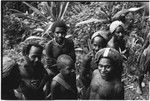 Tuguma carriers, some with barkcloth caps