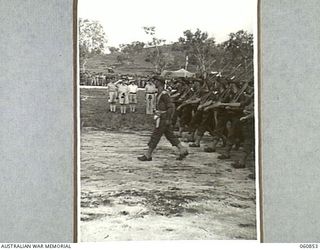 NEW GUINEA. 1943-11-20. NX8 LIEUTENANT GENERAL SIR LESLIE MORSHEAD KCB KBE CMG DSO ED, GENERAL OFFICER COMMANDING, NEW GUINEA FORCE (1), TAKING THE SALUTE FROM UNITS OF THE 18TH AUSTRALIAN INFANTRY ..