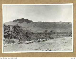 MASAWENG BEACH, NEW GUINEA. 1943-12-25. A JOIN-UP PHOTOGRAPH TAKEN FROM THE BEACH, SHOWING FORTIFICATION POINT ON THE EXTREME RIGHT AND HILL 80 ON EXTREME LEFT (TO JOIN-UP WITH PHOTOGRAPH NO. ..