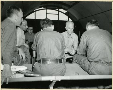 Photograph of Ernie Pyle Interviewing Combat Photographers at Guam