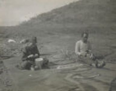 Social Settlements: Hawaii. Wailuku. Alexander House: Alexander House, Wailuku, Hawaii: Native woman and husband, stringing leis made of seeds.