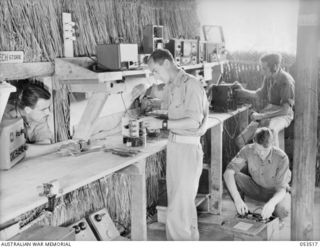 SOGERI VALLEY, NEW GUINEA, 1943-06-26. TECHNICAL MAINTENANCE WORKSHOPS OF THE NEW GUINEA FORCE SCHOOL OF SIGNALS. TROOPS CARRYING OUT TESTING AND MAINTENANCE ARE: QX48150 STAFF SERGEANT (S SGT) C. ..