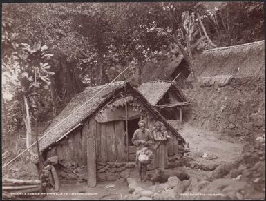 Man, woman and child in the village of Merelava, Banks Islands, 1906 / J.W. Beattie