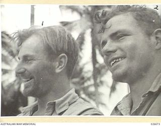 MILNE BAY, PAPUA. 1942-09. FLYING OFFICER B. D. WATSON, (LEFT) AND SERGEANT R. G. RIDDELL, SERVING WITH 75 FIGHTER SQUADRON RAAF IN NEW GUINEA