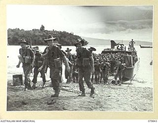 KALAI PLANTATION, NEW BRITAIN. 1945-03-15. TROOPS OF THE 16TH INFANTRY BATTALION, 13TH INFANTRY BRIGADE COMING ASHORE. IDENTIFIED PERSONNEL ARE:- WX36228 PRIVATE L.A. GRAHAM (1); WX19338 SIGNALMAN ..