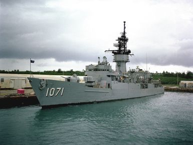 A port bow view of the frigate USS BADGER (FF 1071) moored at a pier