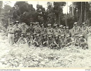 LAE BASE AREA, NEW GUINEA. 1944-12-27. PERSONNEL OF THE 3RD CORPS SALVAGE UNIT. FOR IDENTIFICATION OF THE 25 PERSONNEL SEE FILE