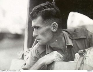 PORT MORESBY, PAPUA, NEW GUINEA. 1944-01-05. VX90176 SERGEANT R.F. BUCHANAN, PHOTOGRAPHER, AUSTRALIAN MILITARY HISTORY SECTION ATTACHED TO HEADQUARTERS, NEW GUINEA FORCE