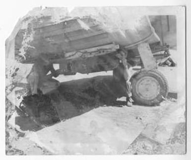 [Construction Battalion Servicemen Equipping Bomb to Bomber Aircraft]