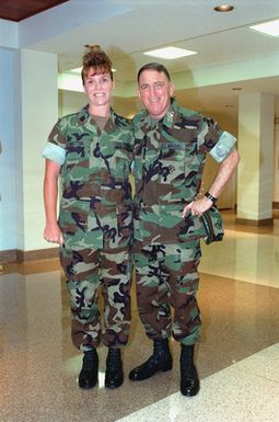 General Charles C. Krulak, 31st Commandant of the Marine Corps, stops for a pose with GUNNERY Seargent Pamela Britton, Administrative CHIEF, while touring Marine Forces Pacific Headquarters at Camp Smith, Hawaii