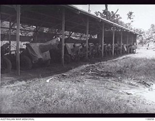 LAE, NEW GUINEA. 1945-12. ARTILLERY STOREHOUSE NO 3 SUB-DEPOT AT 4 ADVANCED ORDNANCE DEPOT