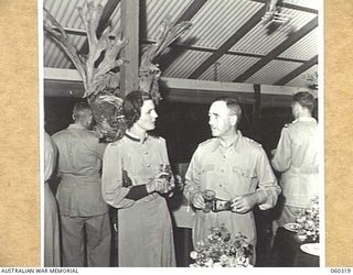 PORT MORESBY, NEW GUINEA, 1943-11-06. NFX12618 MATRON COOK AND NX8 LIEUTENANT GENERAL SIR LESLIE MORSHEAD, KCB, KBE, CMG, DSO, ED., GENERAL OFFICER COMMANDING, NEW GUINEA FORCE, AT A FAREWELL ..