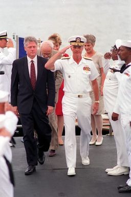 The presidential party arrives to tour the ARIZONA (BB-39) Memorial. President William Jefferson Clinton and Adm. Charles R. Larson, commander-in-chief, U.S. Pacific Fleet, are followed by Secretary of Defense Les Aspin, HIllary Rodham Clinton and Mrs. Aspin. Clinton is in Hawaii to tour area military installations