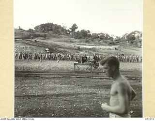 GUSIKA, NEW GUINEA. 1944-04-09. MEMBERS OF THE 2/4TH LIGHT ANTI-AIRCRAFT REGIMENT AT A MEMORIAL SERVICE TO HONOUR MEMBERS KILLED IN THE FINSCHHAFEN - SCARLET BEACH AREA. THE SERVICE WAS CONDUCTED ..