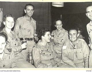 LAE, NEW GUINEA. 1944-09-25. A HAPPY GROUP OF NURSES AND SENIOR NCOS AT THE OFFICIAL OPENING OF NO. 1 SERGEANTS' MESS, HEADQUARTERS NEW GUINEA FORCE. IDENTIFIED PERSONNEL ARE:- SERGEANT T. ..